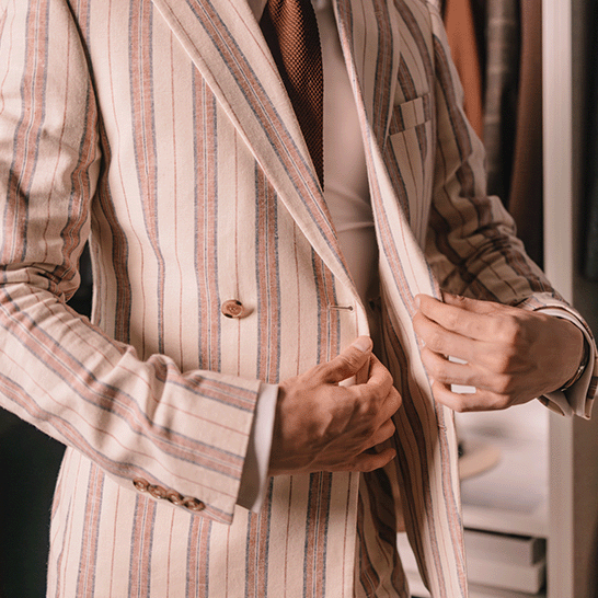 A gentleman adjusting his suit